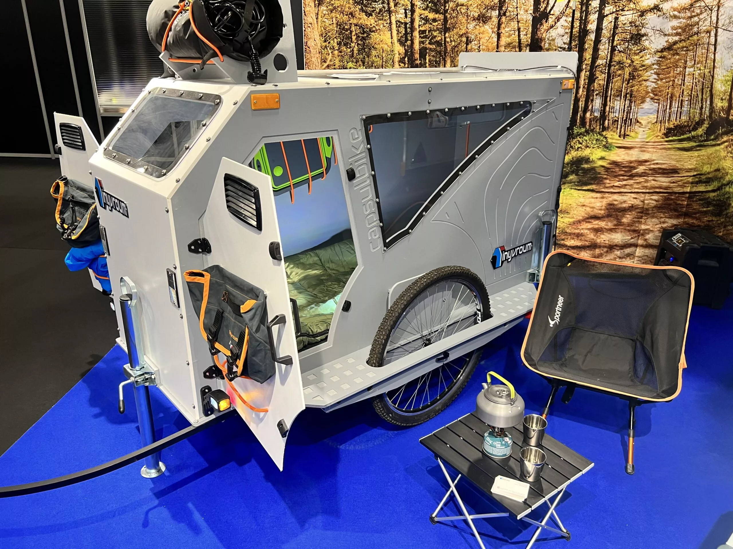 TinyVroum uses a backpacking-style stove and cooking setup as a lightweight solution for use with the CapsulBike