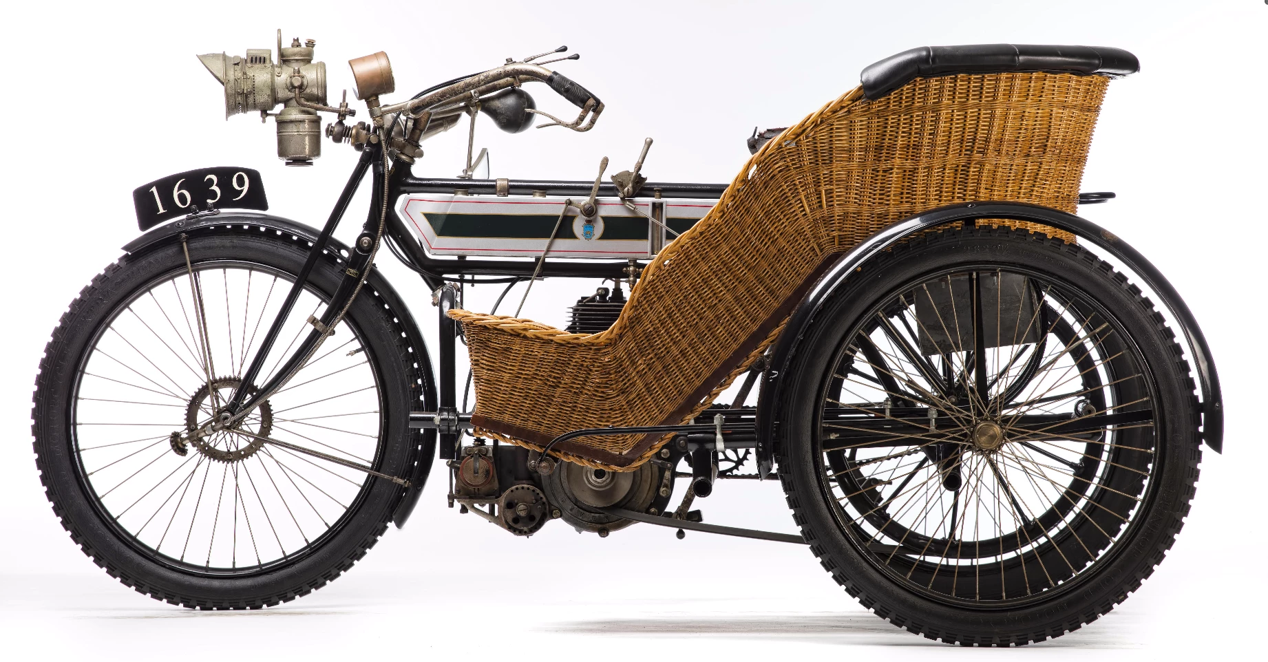 One of the great buys of the sale, and a perfect example of the lengths an enthusiast will go to in order to bring a bike back to life was this 1908 Triumph 3½hp sidecar combination which sold for £14,950 (US$ 18,181). It was first registered in 1908 in South Australia, dismantled for reconditioning prior to WWI and rediscovered in 1975 in a dismantled state with the parts spread around a large workshop. The vendor at this sale purchased the workshop's entire contents to ensure he got all needed parts for restoration. The bike was found to be complete except for the wicker sidecar body, so a replica of the latter was made to attach to the archeologically-manifested restoration. At 108 years of age and quite beautiful, it's a time warp and a magnificent restoration for the rather meagre price.