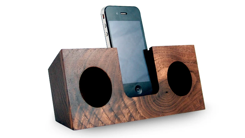 The Koostik iPhone dock utilizes the smartphone's own speakers, and channels the audio into hollowed out, hemispherical sound chambers where the sound is amplified by up to four times