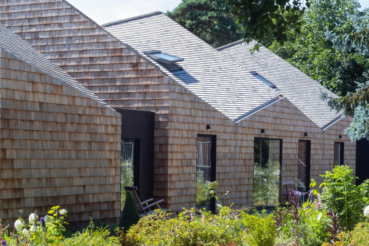 Five Acre Barn is defined by its undulating roofline that's wrapped in cedar shingles