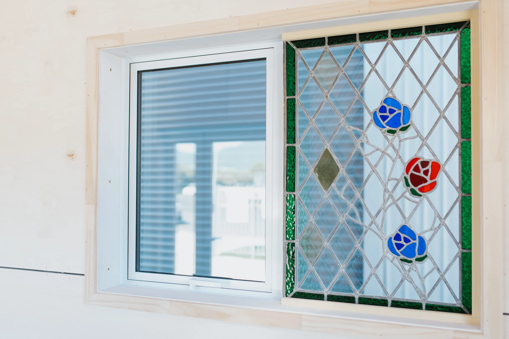 The Purple Palace includes a small stained glass window that already belonged to the owner