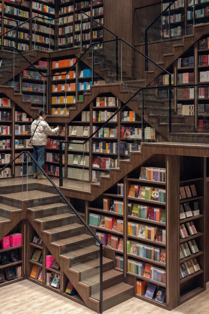 Staircases double as bookshelves inside the Chongqing Zhongshuge Bookstore