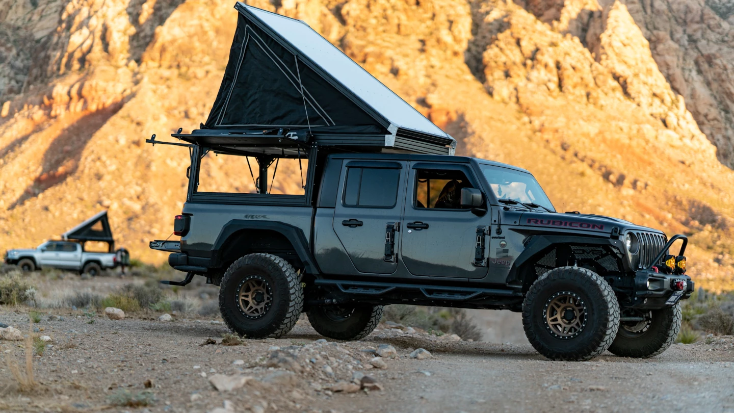 The strut-assisted pop-top area has a two-panel sleeping platform that extends the full length of the Packout camper