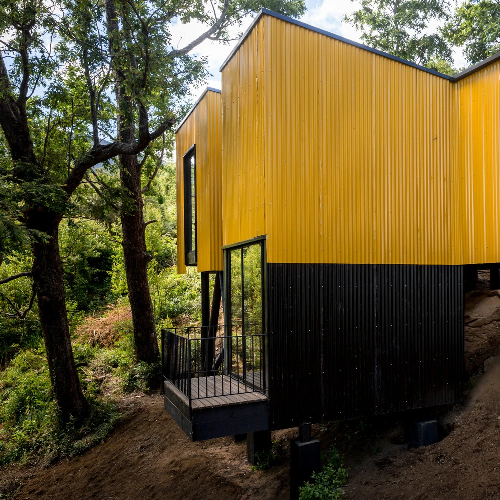 Yellow House is located in the beautiful forest setting of Pucón, Chile