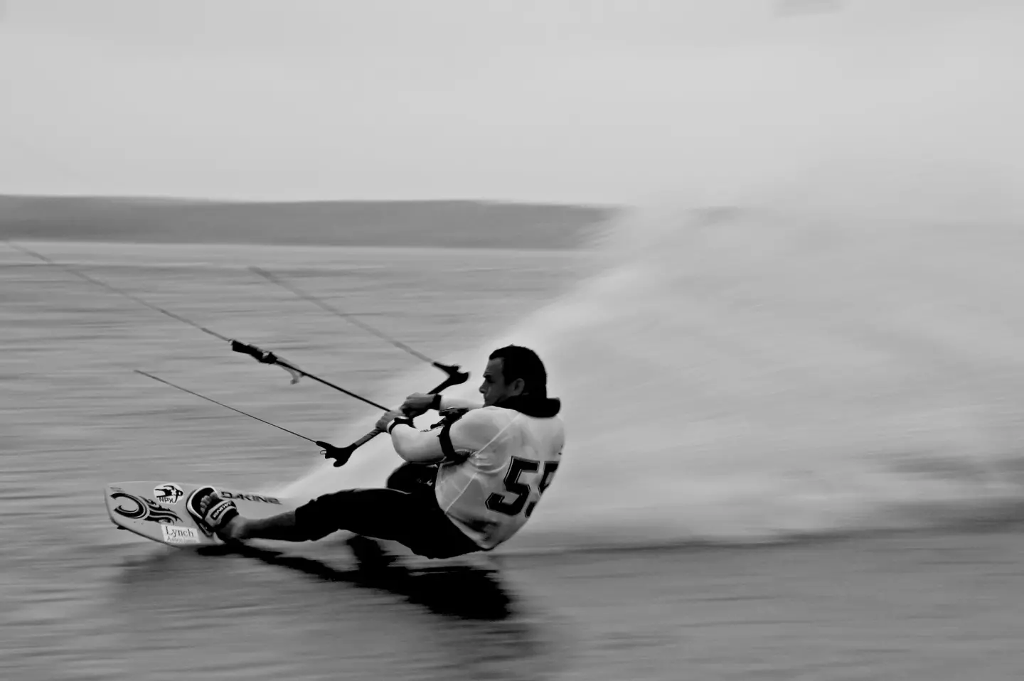 The fastest kitesurfer in the world (US-55 - Robbie Douglas) is also the proprietor of Black Dog Clothing Company. From his Facebook page.