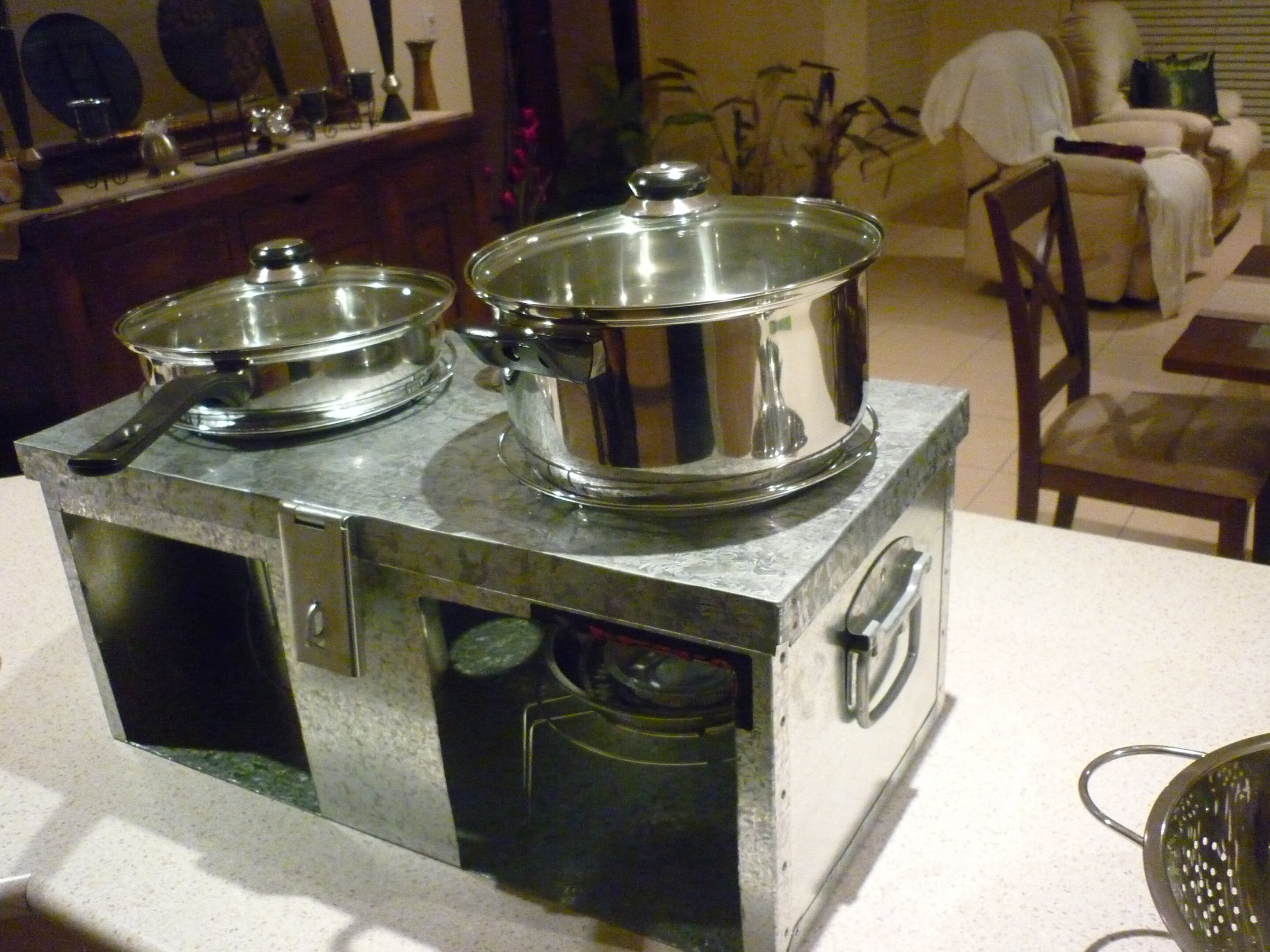 Cleaner-burning cook stove designed for use in developing nations
