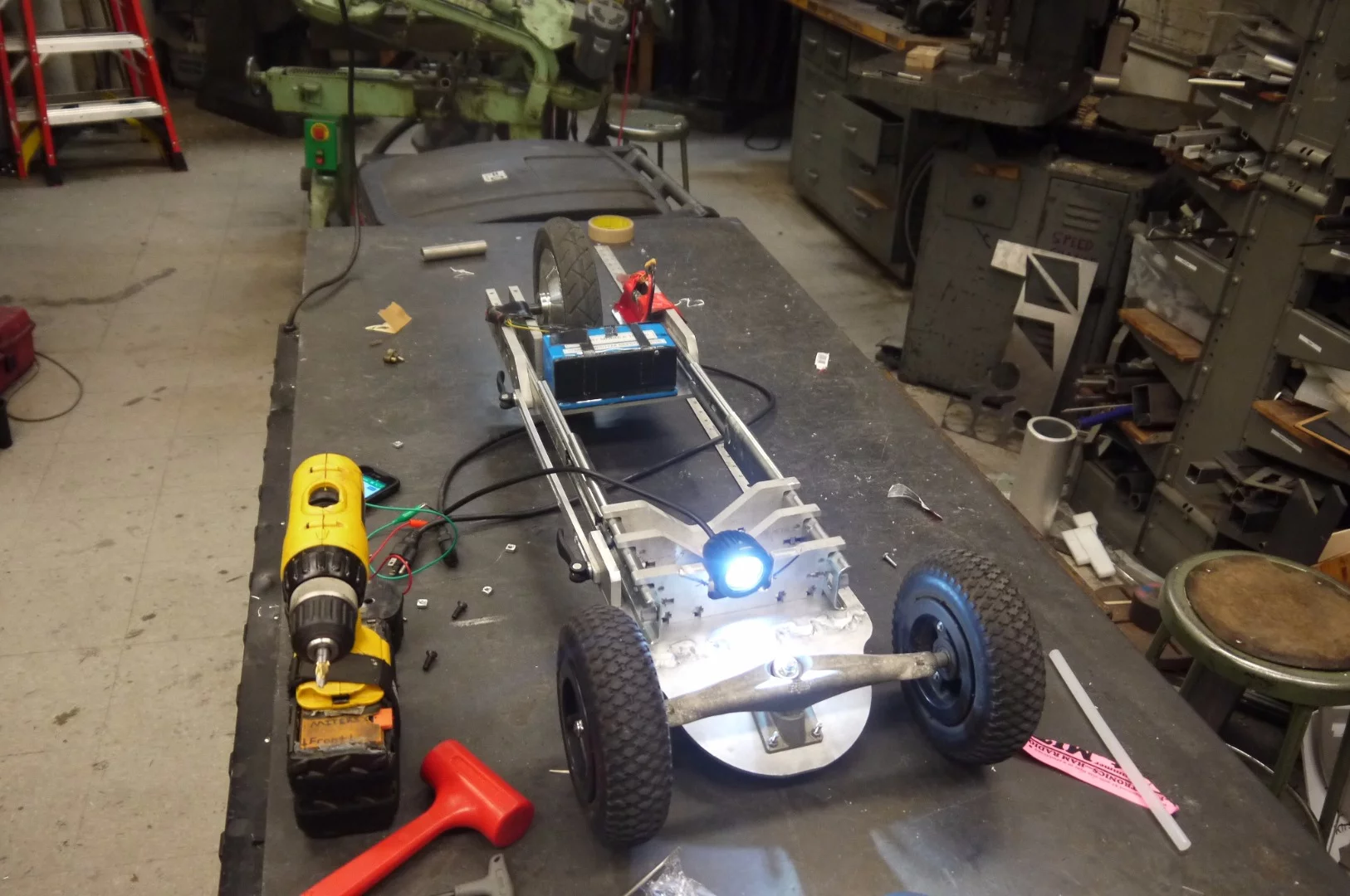 Testing the LED headlight, which would later be connected to the battery pack with a coiled cable