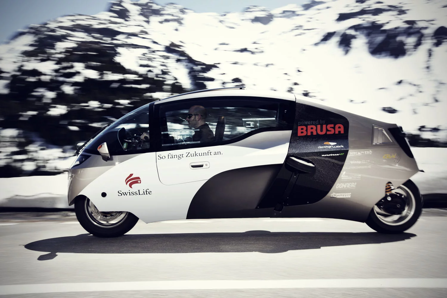 The Swiss Zerotracer is one of the most interesting enclosed, feet-forward motorcycle designs yet seen. The small frontal area of a motorcycle is one of the key reasons motorcycles are so fuel efficient (the other being a small motor), but when the generally poor aerodynamic drag coefficient of the motorcycle becomes a streamliner, it really can produce exception energy efficiency, as was proven when the Zerotracer won the around-the-world electric race in 2011.