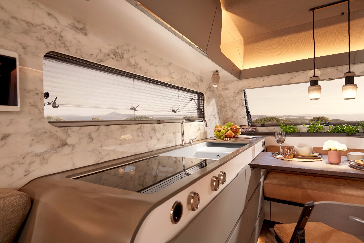 The kitchen includes a cooktop with induction hob