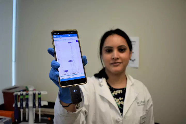 Postdoctoral fellow Richa Pandey, with the bacteria-detecting prototype