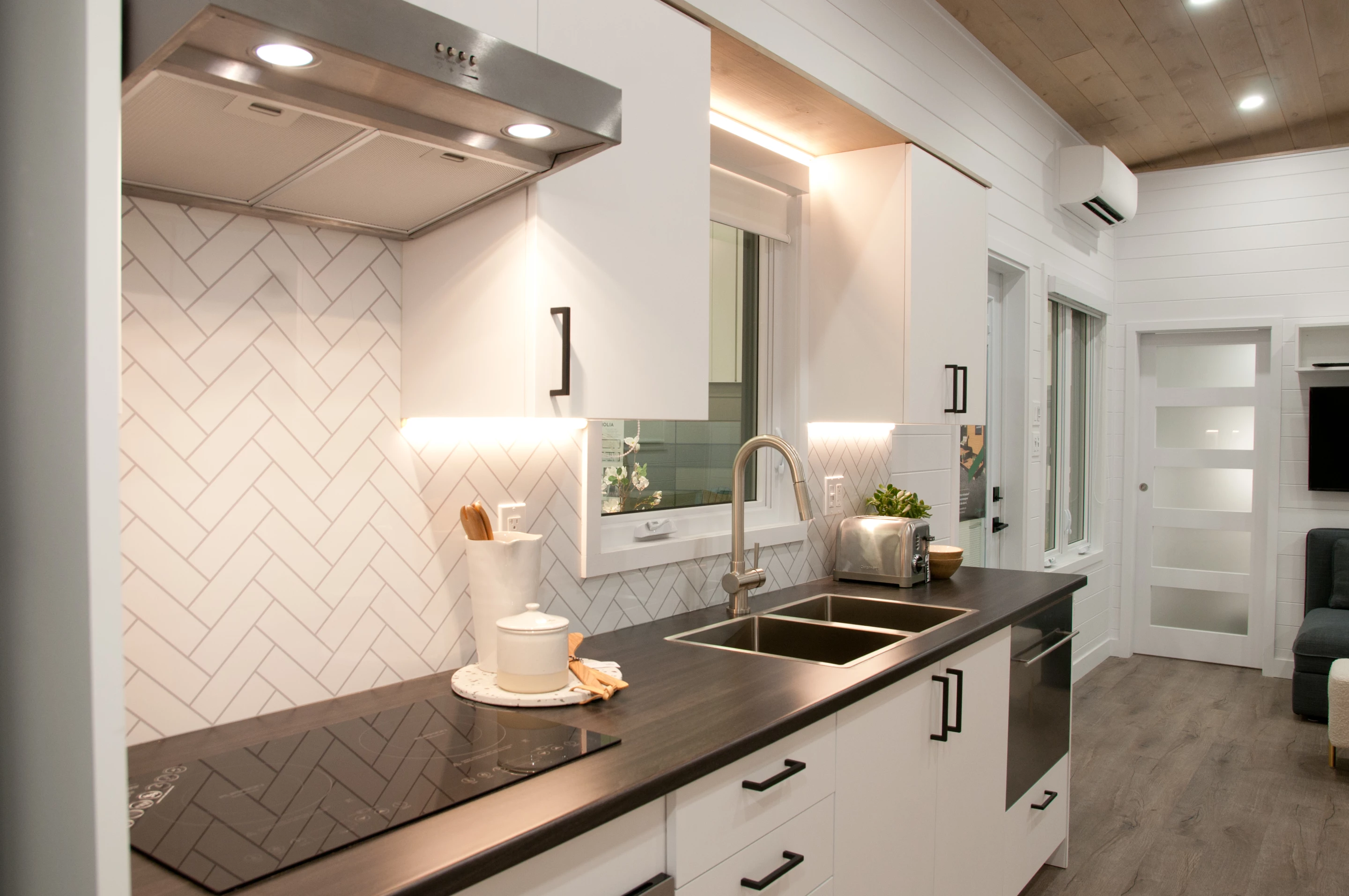 The Charme's kitchen has a small dishwasher, which is still quite a luxury in a tiny house