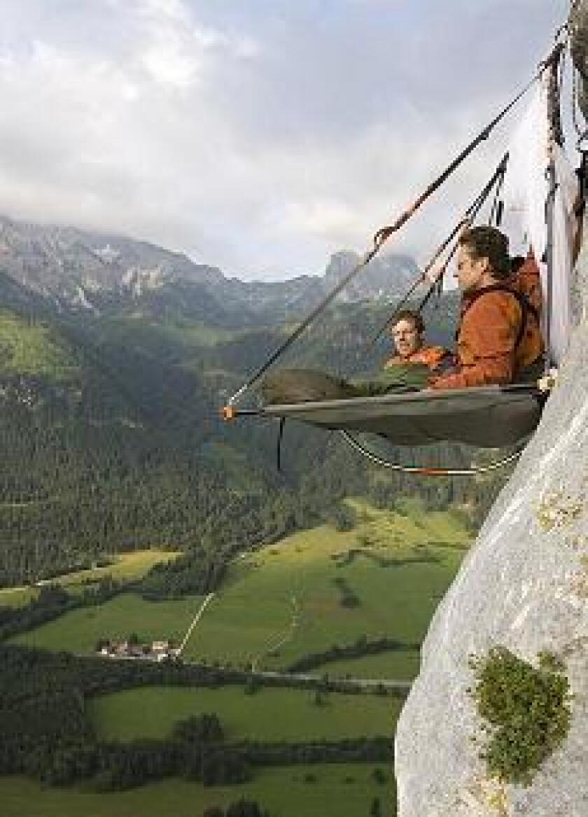 An extreme camping experience, on an overhanging platform, positioned over a huge mountainous cliff face (Photo: Waldseilgarten)