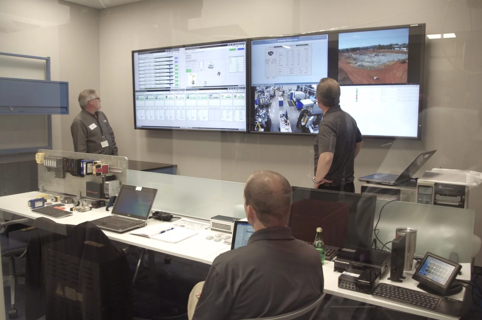 GE workers monitoring the factory's machines which are connected using an Internet of Things approach