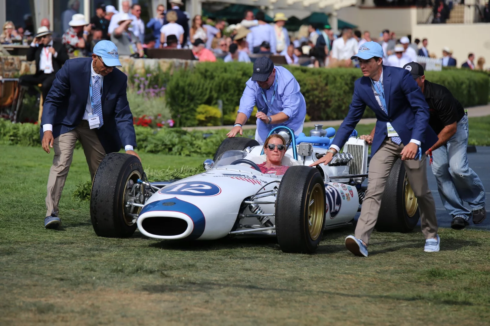 Rolling an Indy 500 entry off the podium with one of the rare female drivers at the wheel