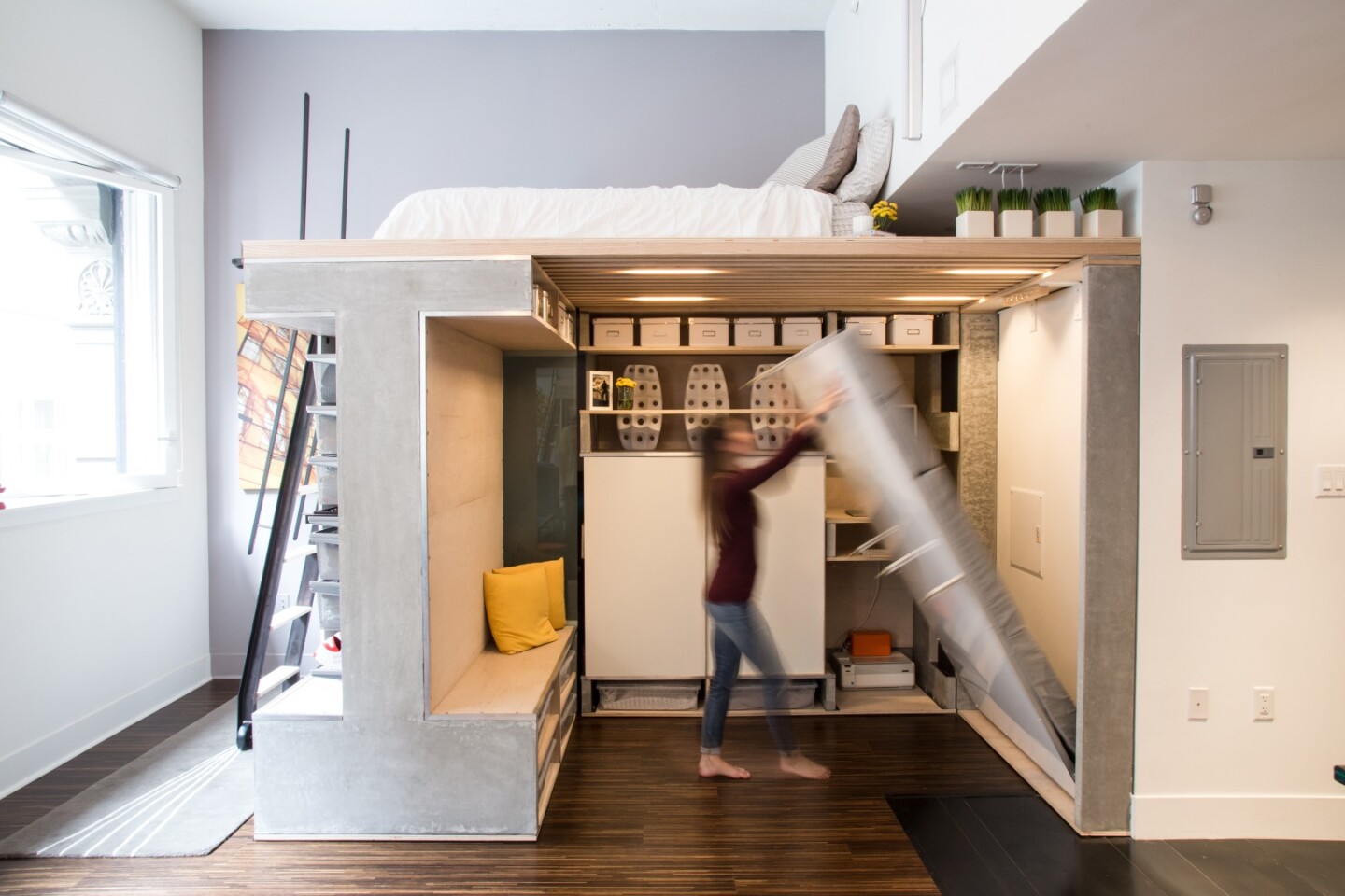 The dry-erase board wall folds down to provide a second bed