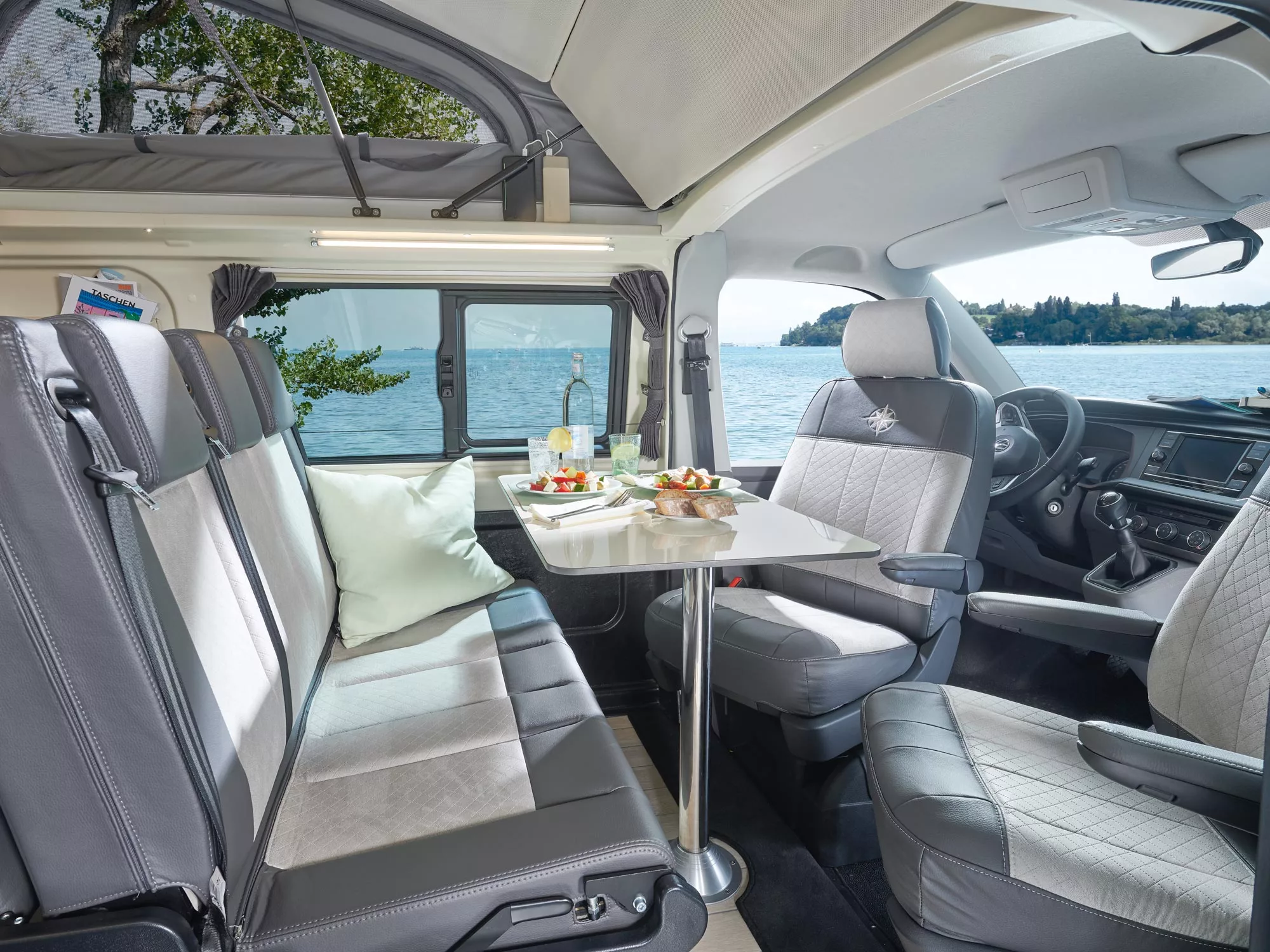 Swivel cab seats and a removable pedestal table create a dining area for five people