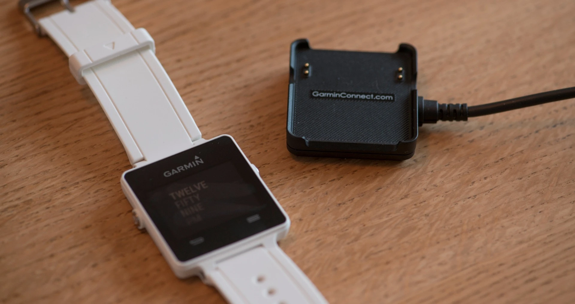 The Garmin vivoactive comes with a boxy proprietary USB charger which magnetically snaps to the bottom of the watch