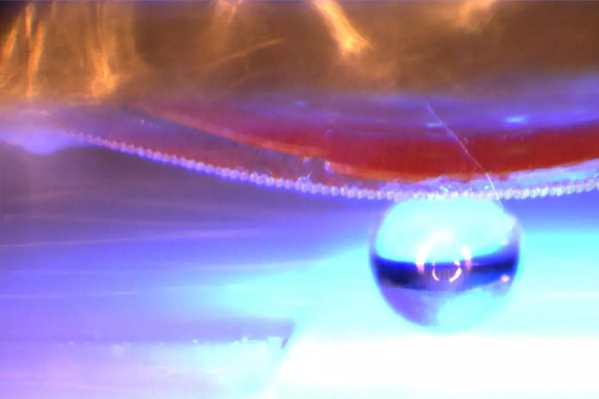 The material is used to lift a 1-mm diameter glass sphere