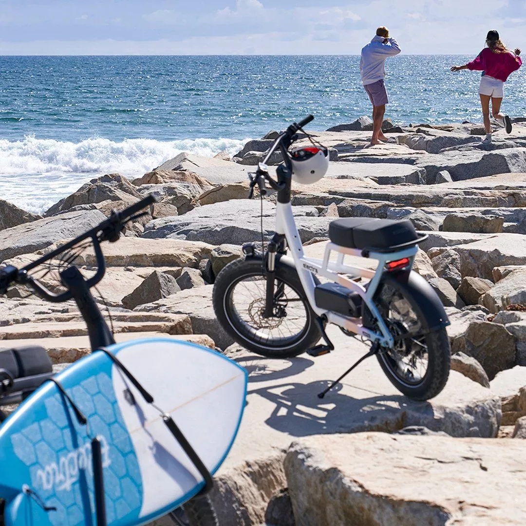 Optional accessories include a front rack, frame bag and surfboard carrier