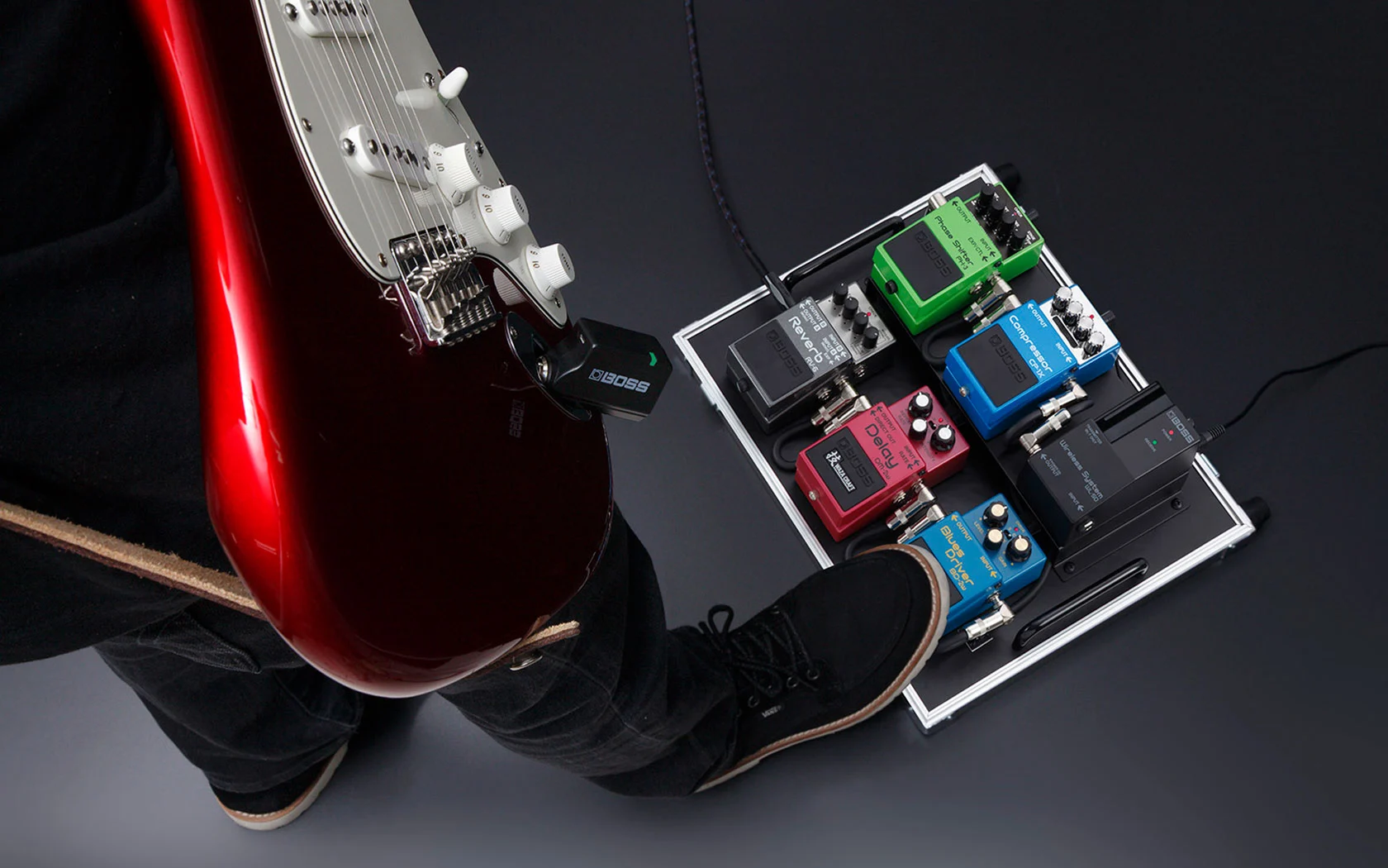 The Boss WL Series includes a pedalboard receiver dock for inclusion in a stomp chain, and connecting wirelessly using a transmitter plugged into a guitar