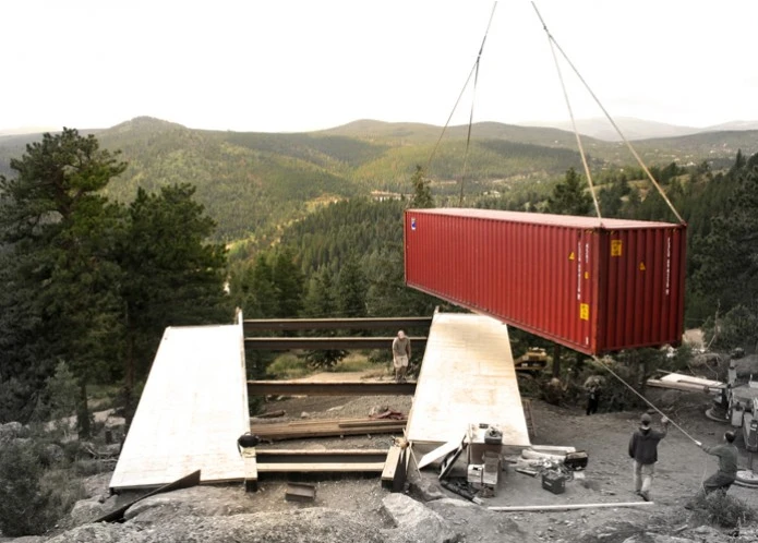 The Shipping Container House under construction - the first container being lowered into place