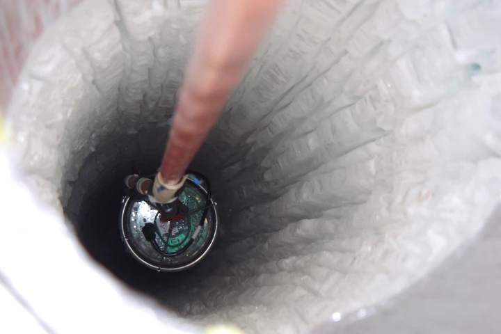 One of IceCube's digital optical modules being lowered into the ice