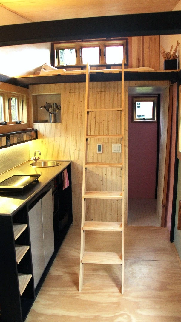 The primary sleeping area is accessed by ladder
