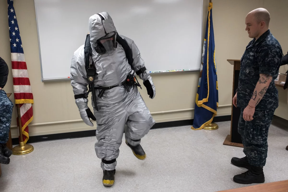 Machinist's Mate nuclear 2nd Class Cameron Sebastian tests a prototype submarine steam suit ensemble