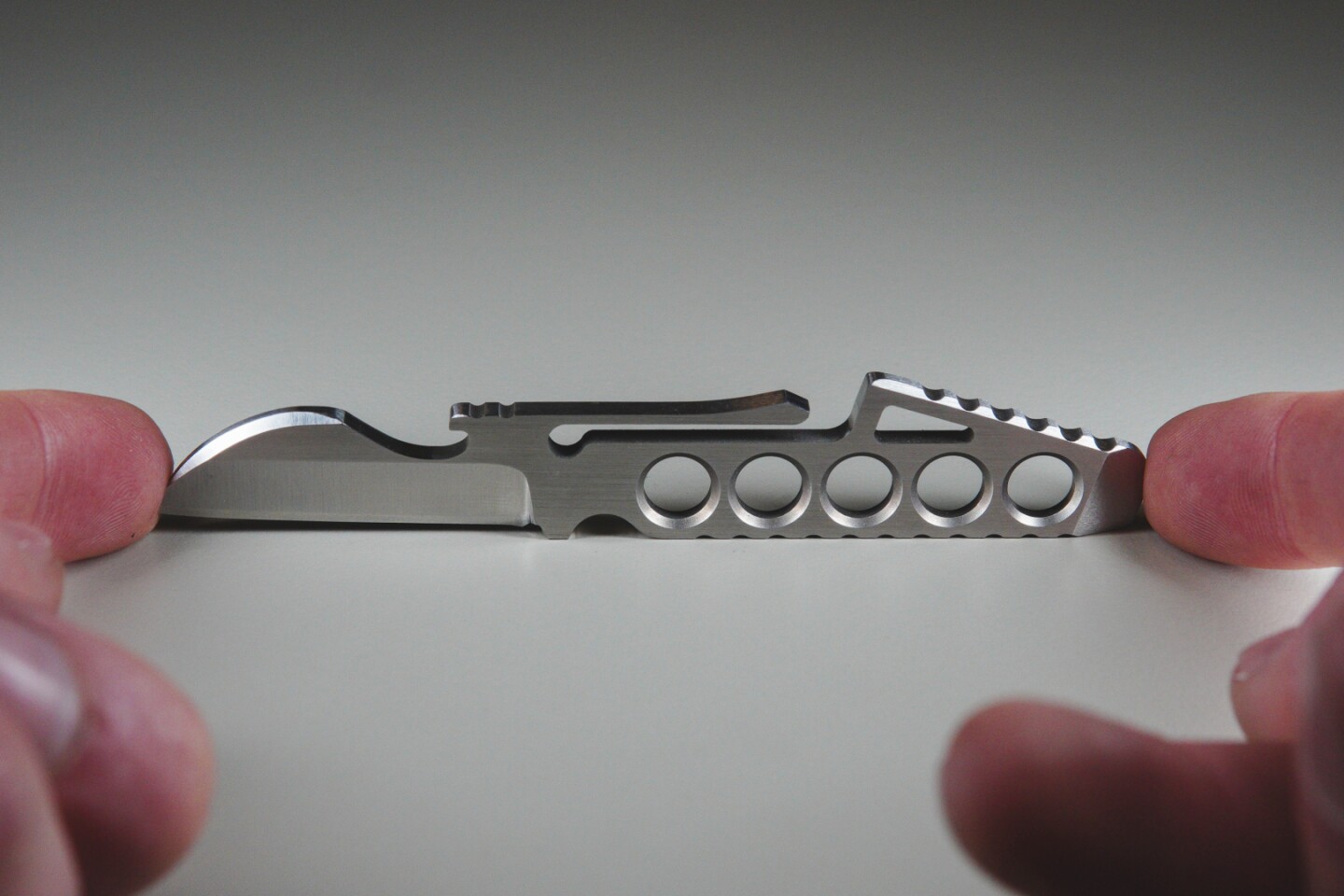 The knife has a built-in bottle opener