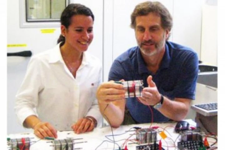 Penn State researchers, Bruce Logan, and Maha Mehanna, with the three-chambered microbial desalination cells (Photos: Dave Jones, Penn State)