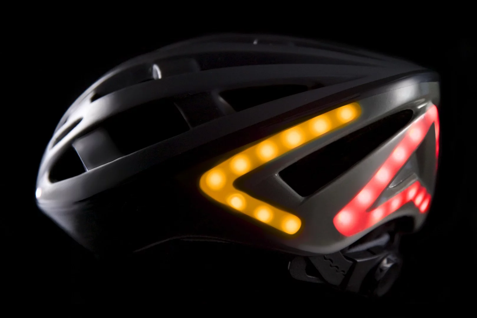 Bright LED turn signal lights are operated remotely on the Lumos bicycle helmet.
