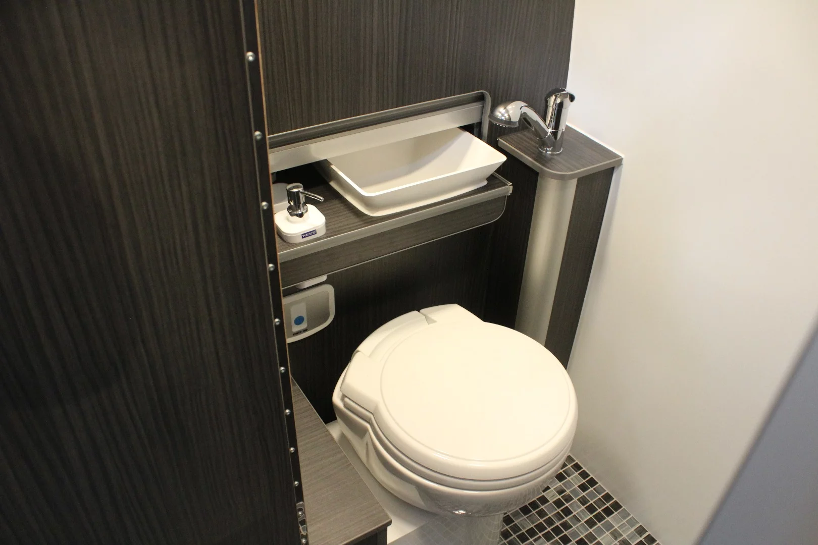 Slide the sink out of the way and you have access to the toilet