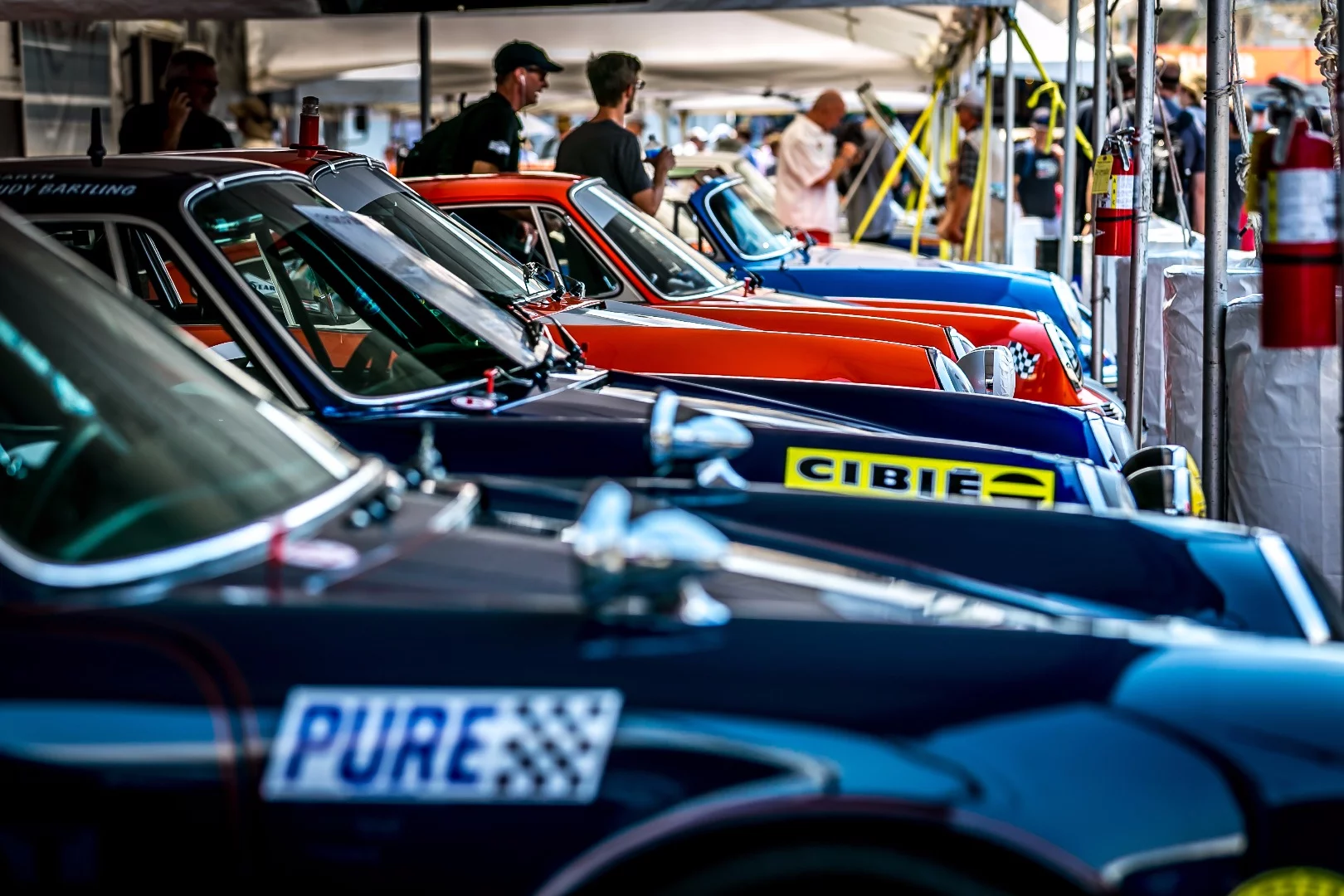 A flock of Porsche's awaiting their time on track