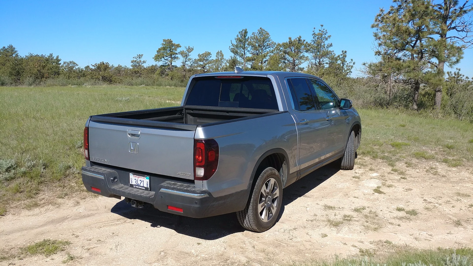The cargo bed for the Honda can hold 4-ft (1.2-m) wide sheets of plywood or wall board – laid flat
