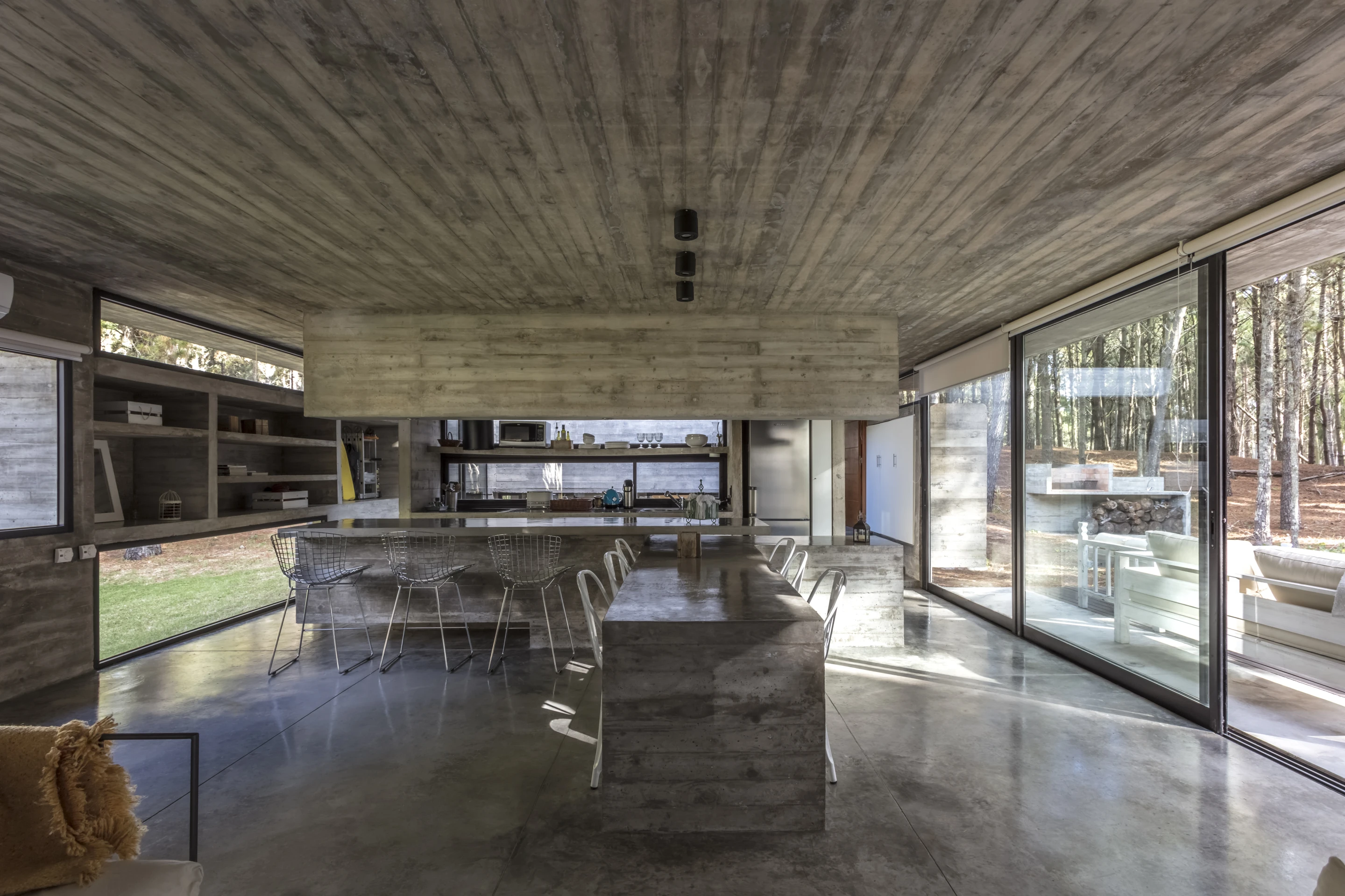 Almost every element of the Forest House is made with concrete, except for the decking, doors, windows, beds, sofas and chairs