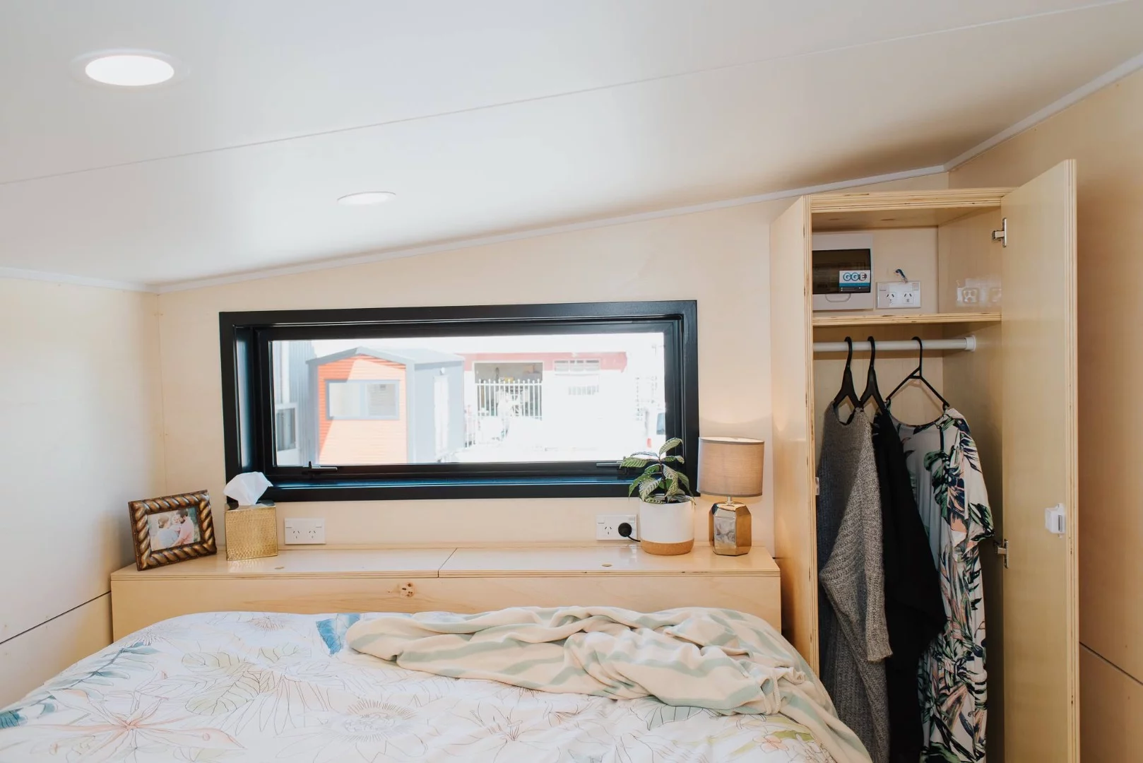 La Sombra Tiny House's main bedroom has a wardrobe