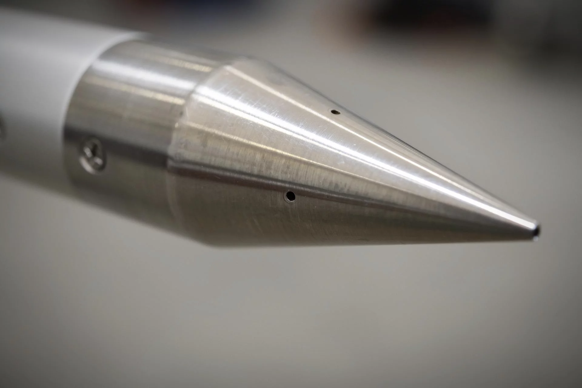 This close-up of a shock-sensing cone shows the ports through which the device will measure air pressure changes during supersonic flight