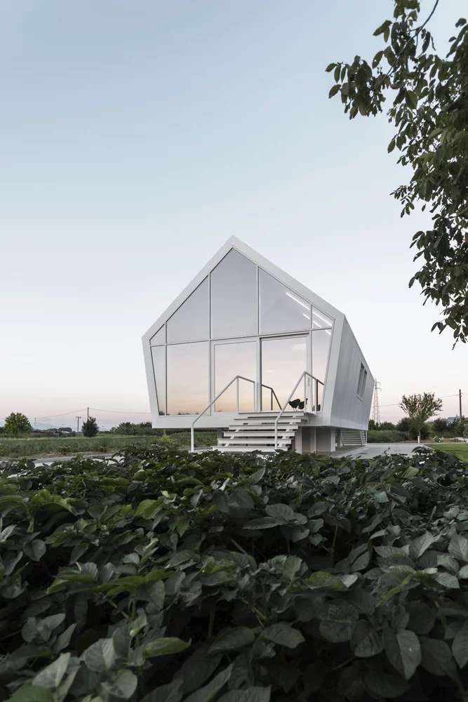 Italian architectural studio LDA.iMdA has recently completed a sustainable compact home that hovers above the ground