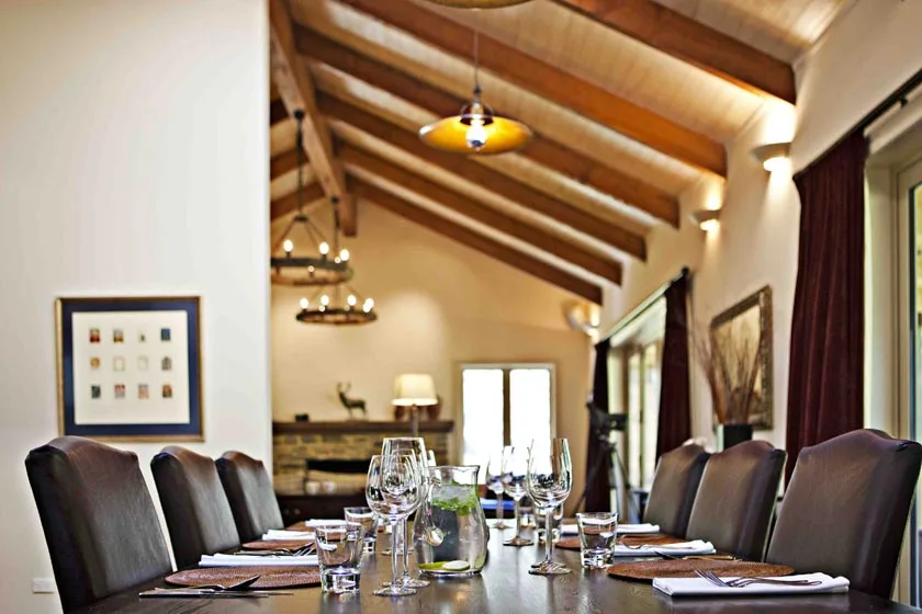 The "Mountain Kitchen" features well-stocked cupboards, dining room, living area, open fires and a first class chef