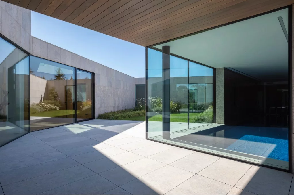 A stunning play of light and shadow through expansive glass walls