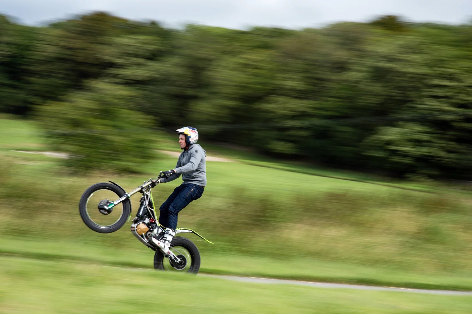 Trials champion Dougie Lampkin prepares to wheelie the Isle of Man TT course