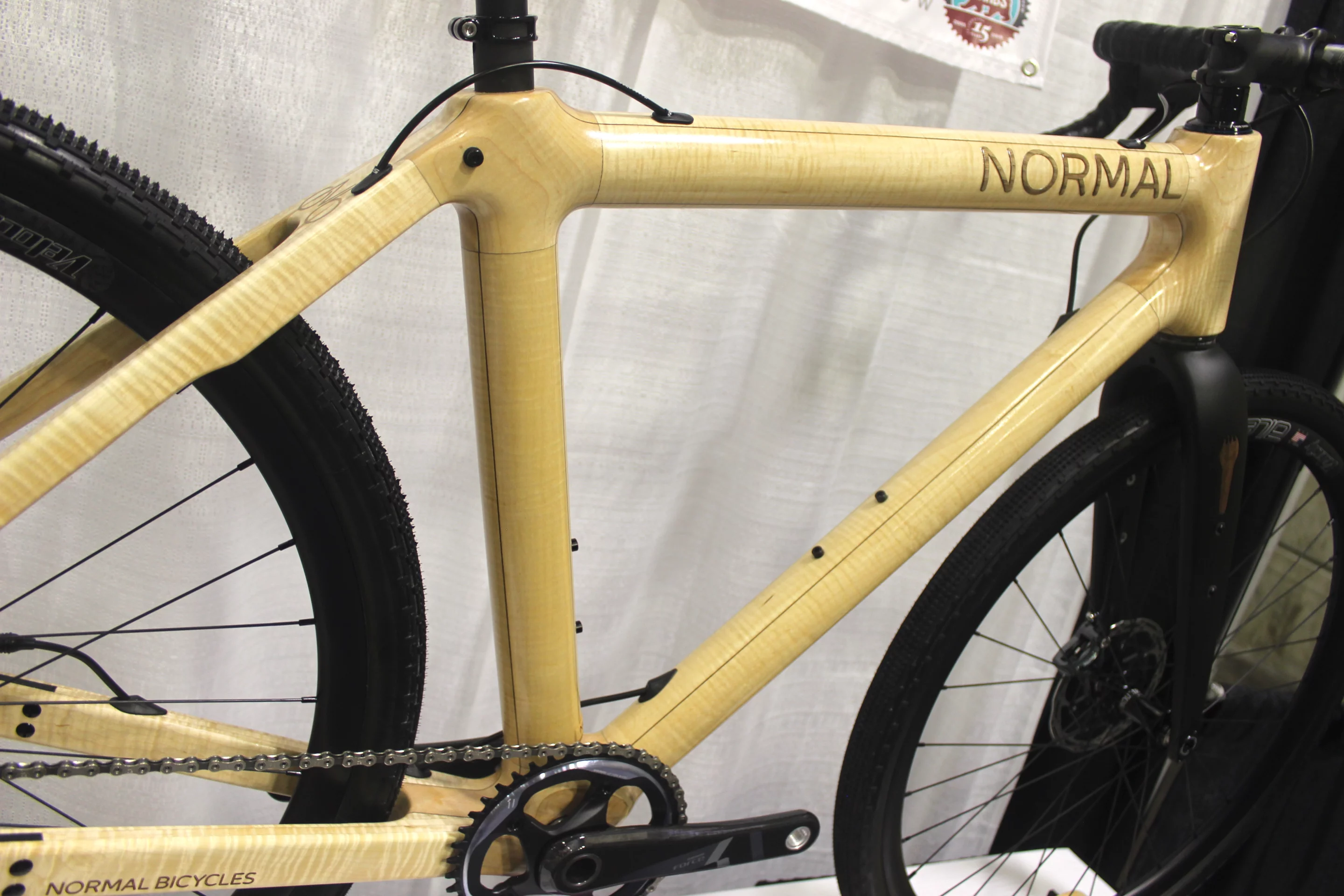 Normal Bicycles utilizes frame tubes made from laminated layers of maple veneer, as opposed to the more traditional wooden-bicycle-building approach of taking two carved-out sides and bonding them together down the middle