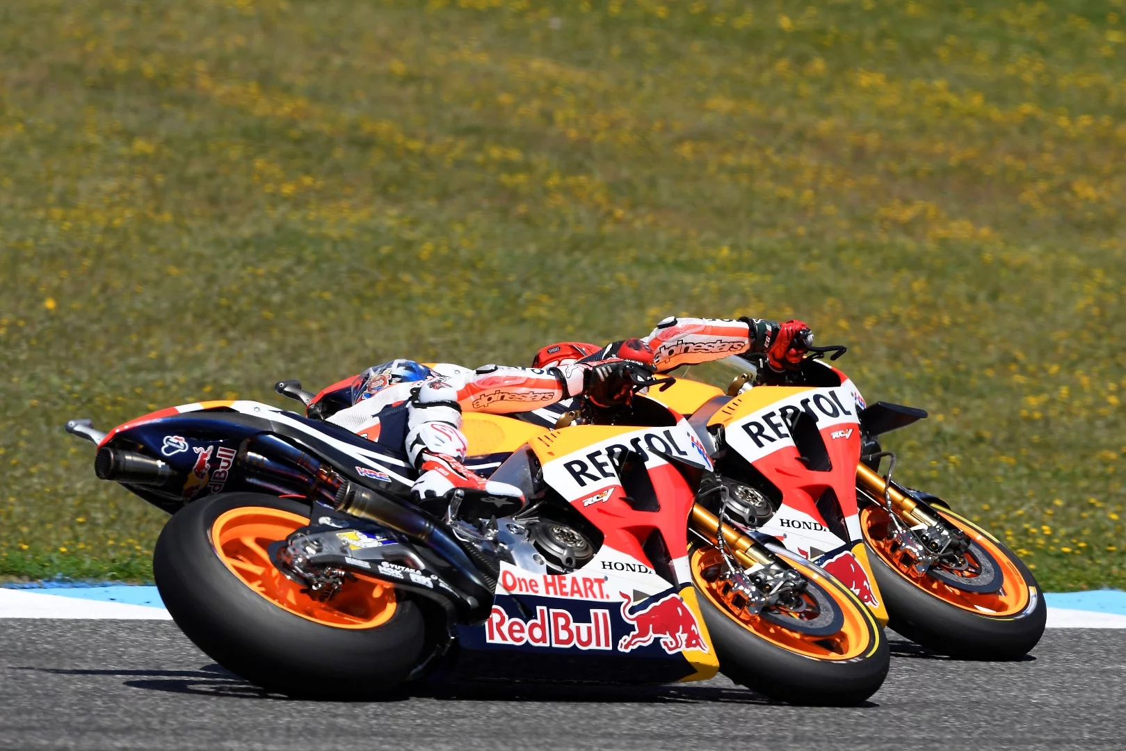 The two Repsol Honda riders, Marc Marquez and Dani Pedrosa, racing on different wing variants