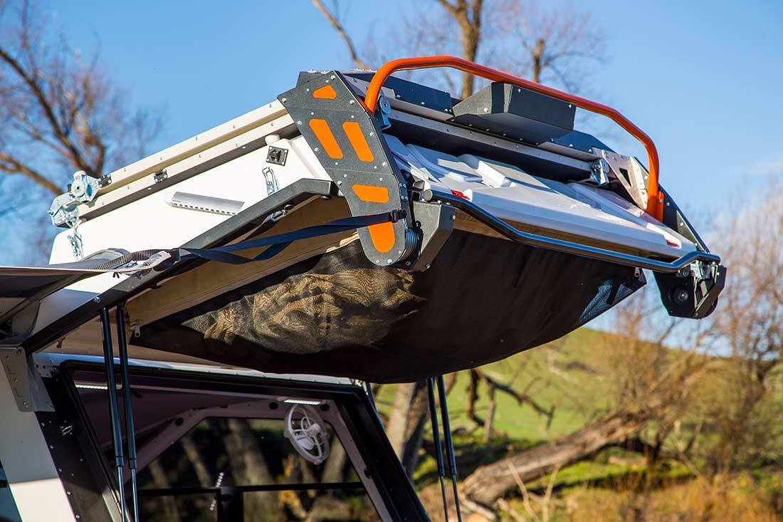 The hatch door houses the tent, keeping it off the bed so campers can easily use just the trailer interior without having to set up or move the tent