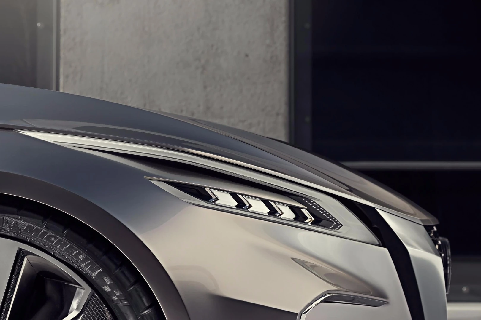 Tiny, multi-bezeled headlamps and daytime running lights are thinly inset into the front corners of the Vmotion 2.0