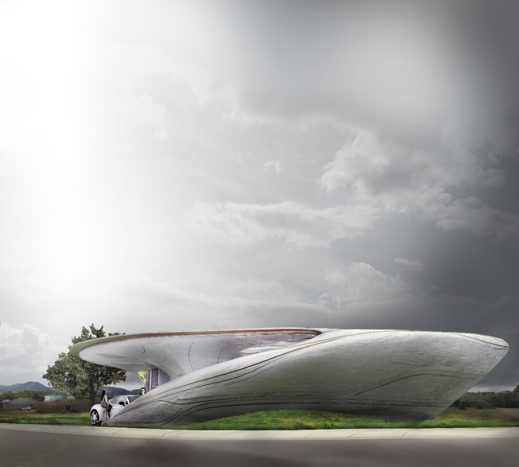 The curved form is designed to blend with the site like an organic presence