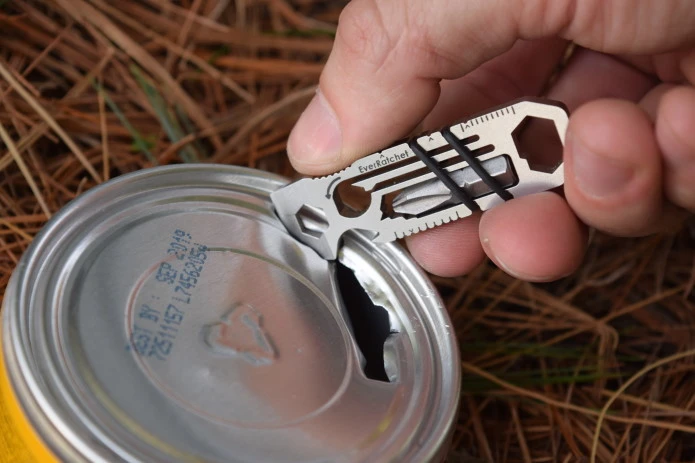 The EverRatchet multitool's scraper implement at work opening a can