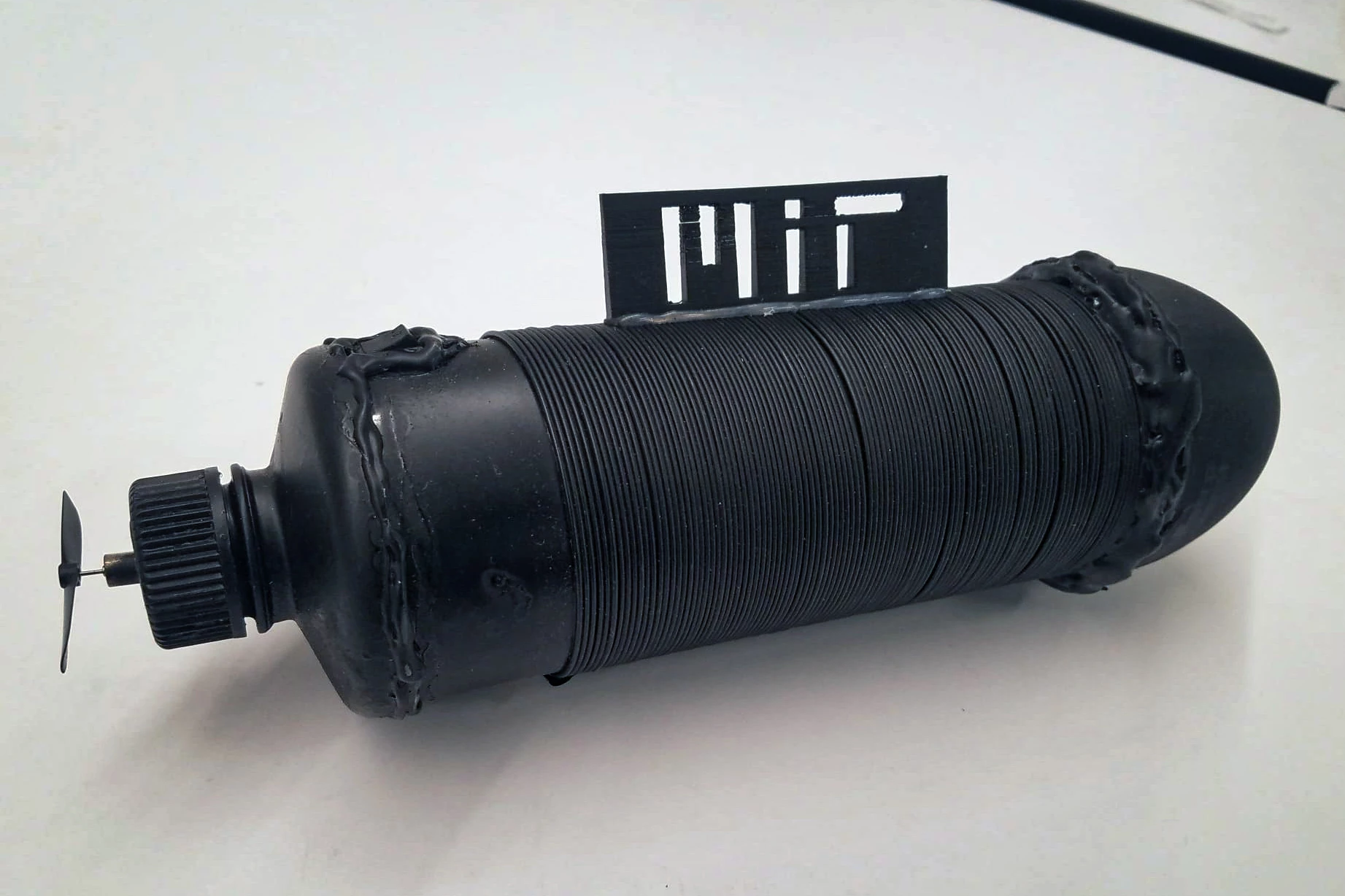 MIT researchers wrapped their flexible, fiber battery around the body of a toy submarine to act as its power source