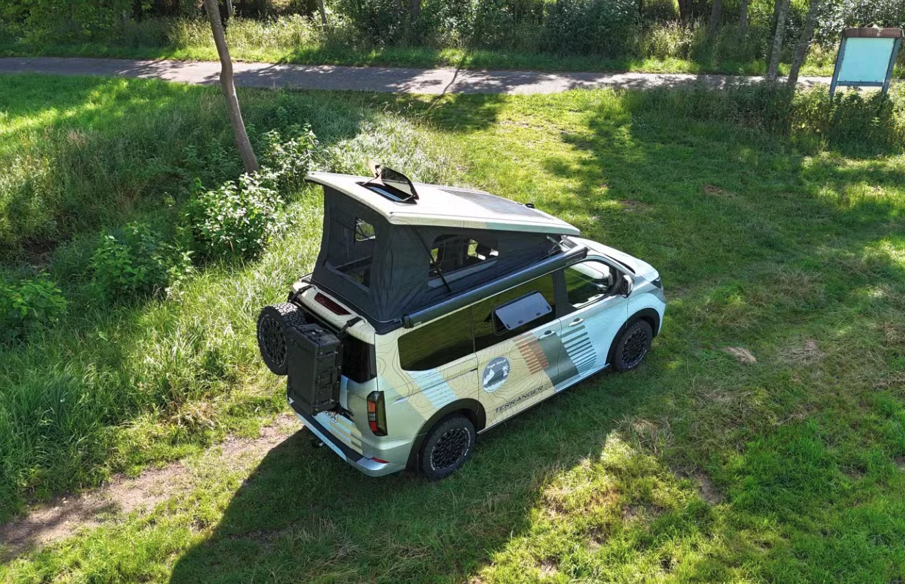 The conversion includes pop-open rooftop and side windows