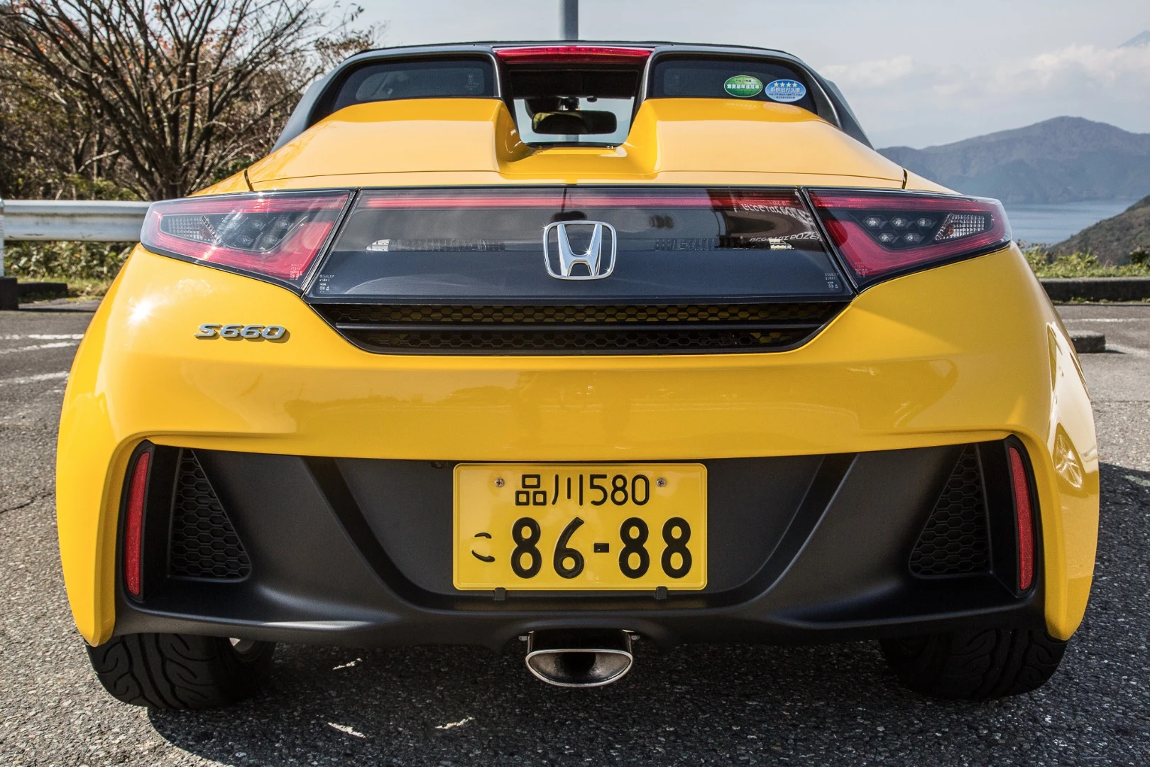 Those yellow plates are a sign the S660 fits Japan's Kei-car laws